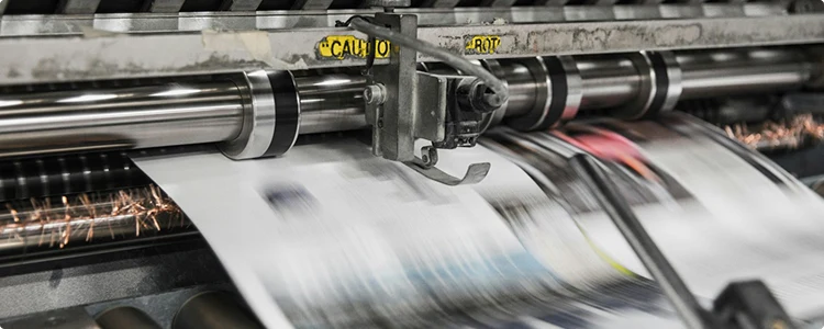 Printed sheets running through a press
